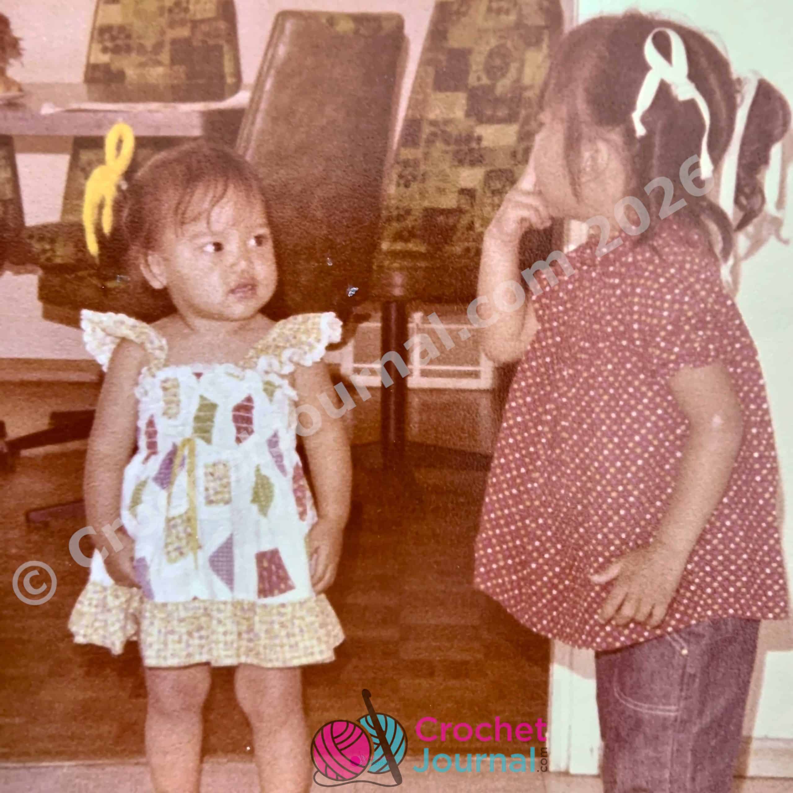 two little girls looking at each other