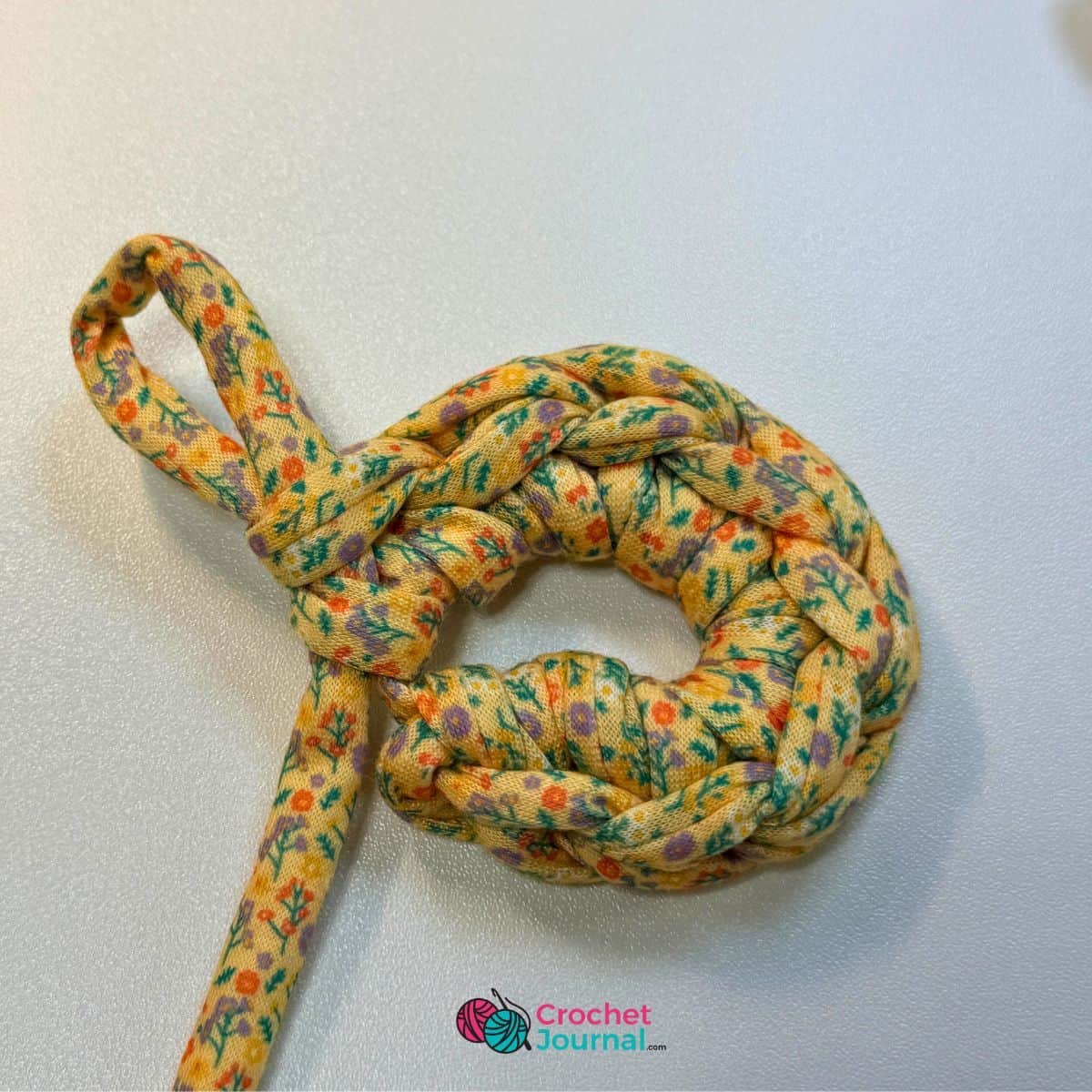Colorful floral crochet fabric yarn for craft projects and decorations.